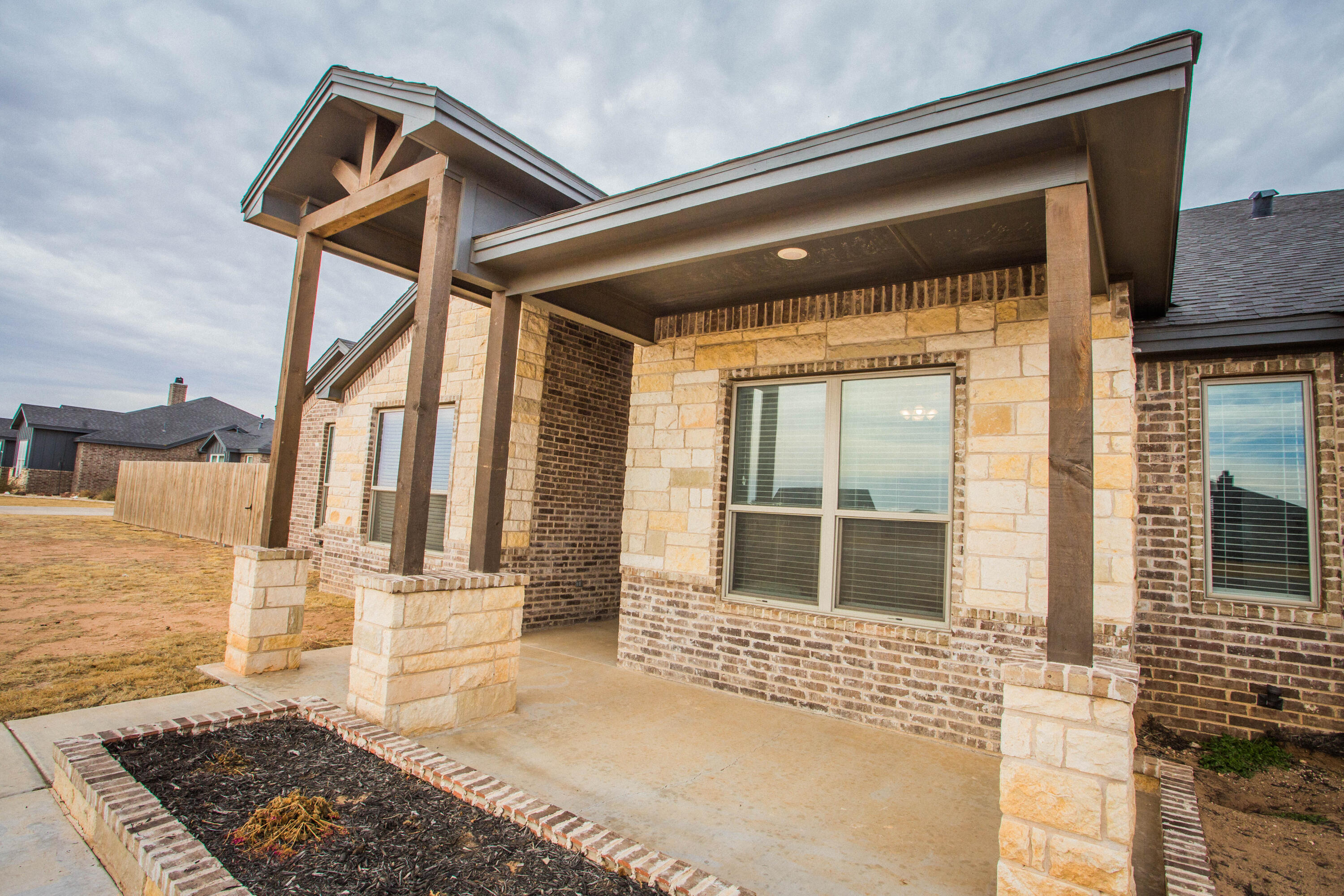 2204 County Road 7815 Lubbock, TX 79423 - Photo 9 of 58 a front view of a house with large windows