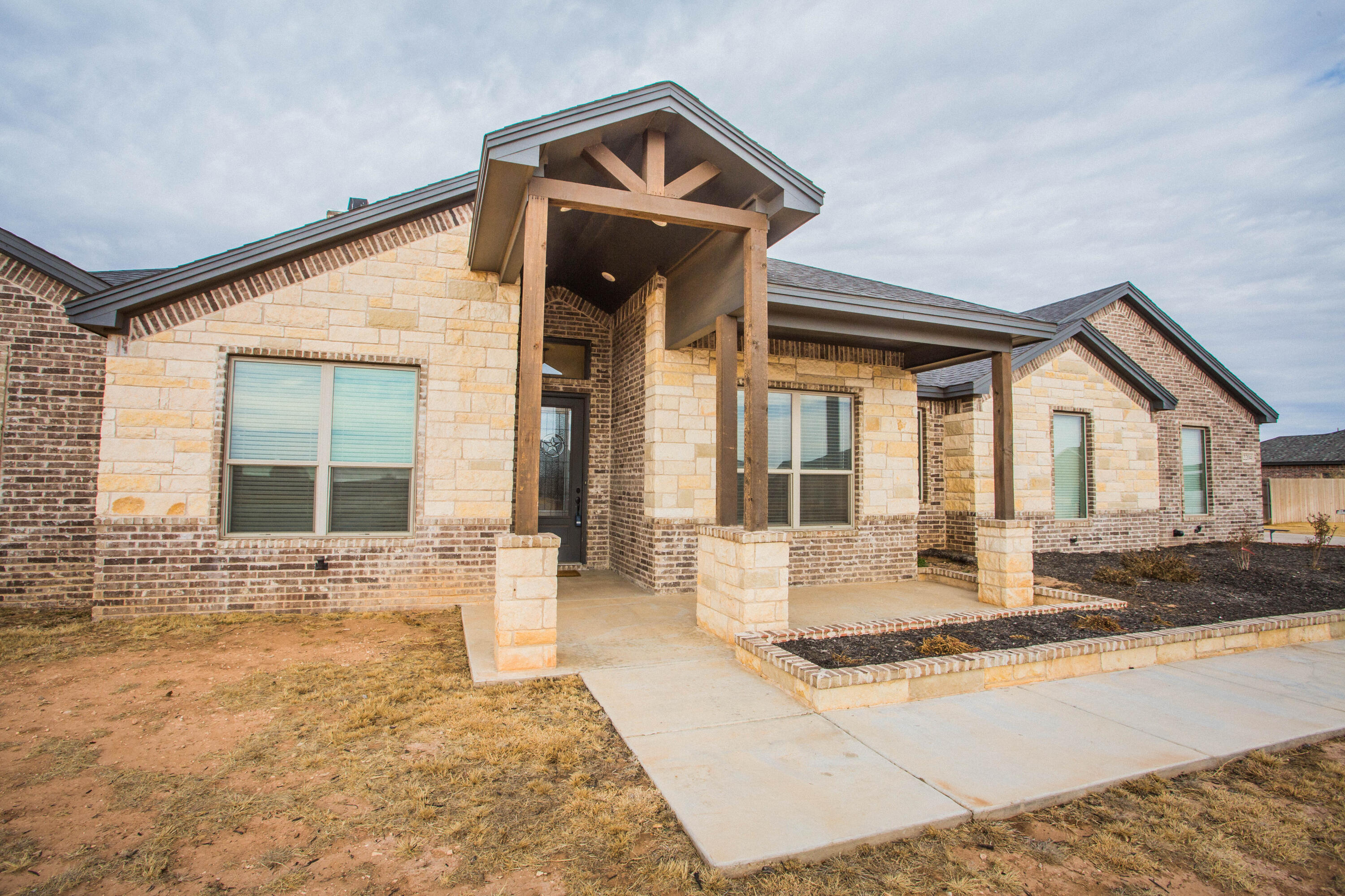 2204 County Road 7815 Lubbock, TX 79423 - Photo 10 of 58 a front view of a house with a yard