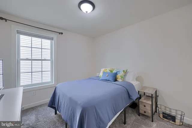 a bedroom with a bed and a television in it