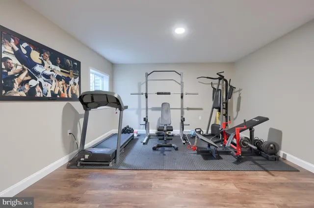 a front view of a house with a garden and plants