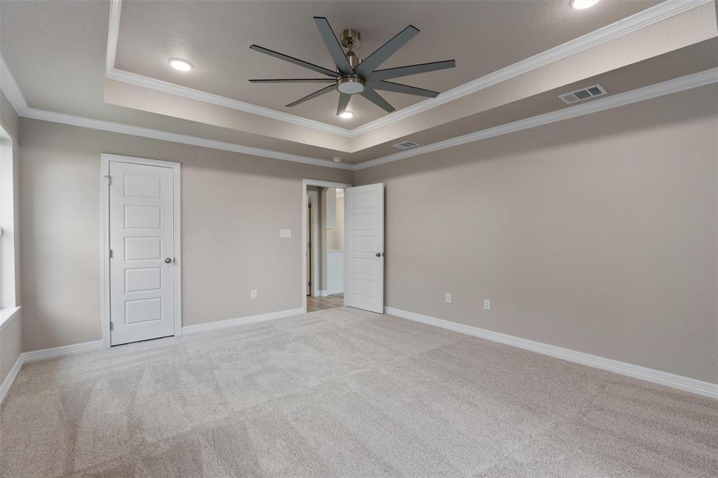 1341 Promised Land Road Hewitt, TX 76643 - Photo 13 of 29 Spacious room featuring a tray ceiling with recessed lighting and a ceiling fan