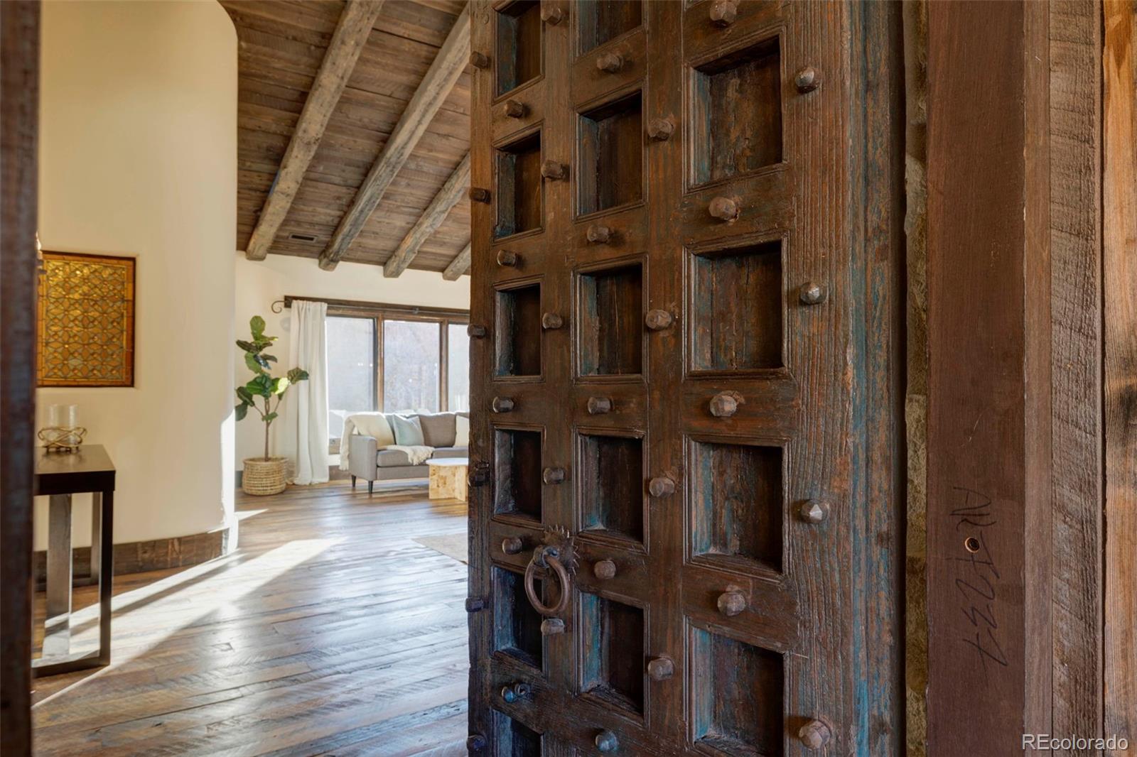 3755 North Rampart Range Road Littleton, CO 80125 - Photo 24 of 50 a view of an entryway with wooden floor