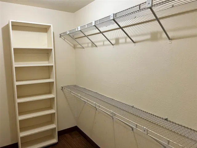 a view of a garage with cars