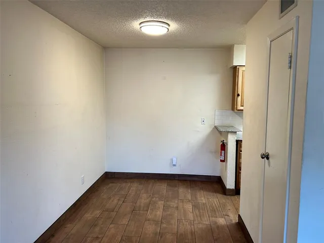 a kitchen with a stove microwave and refrigerator