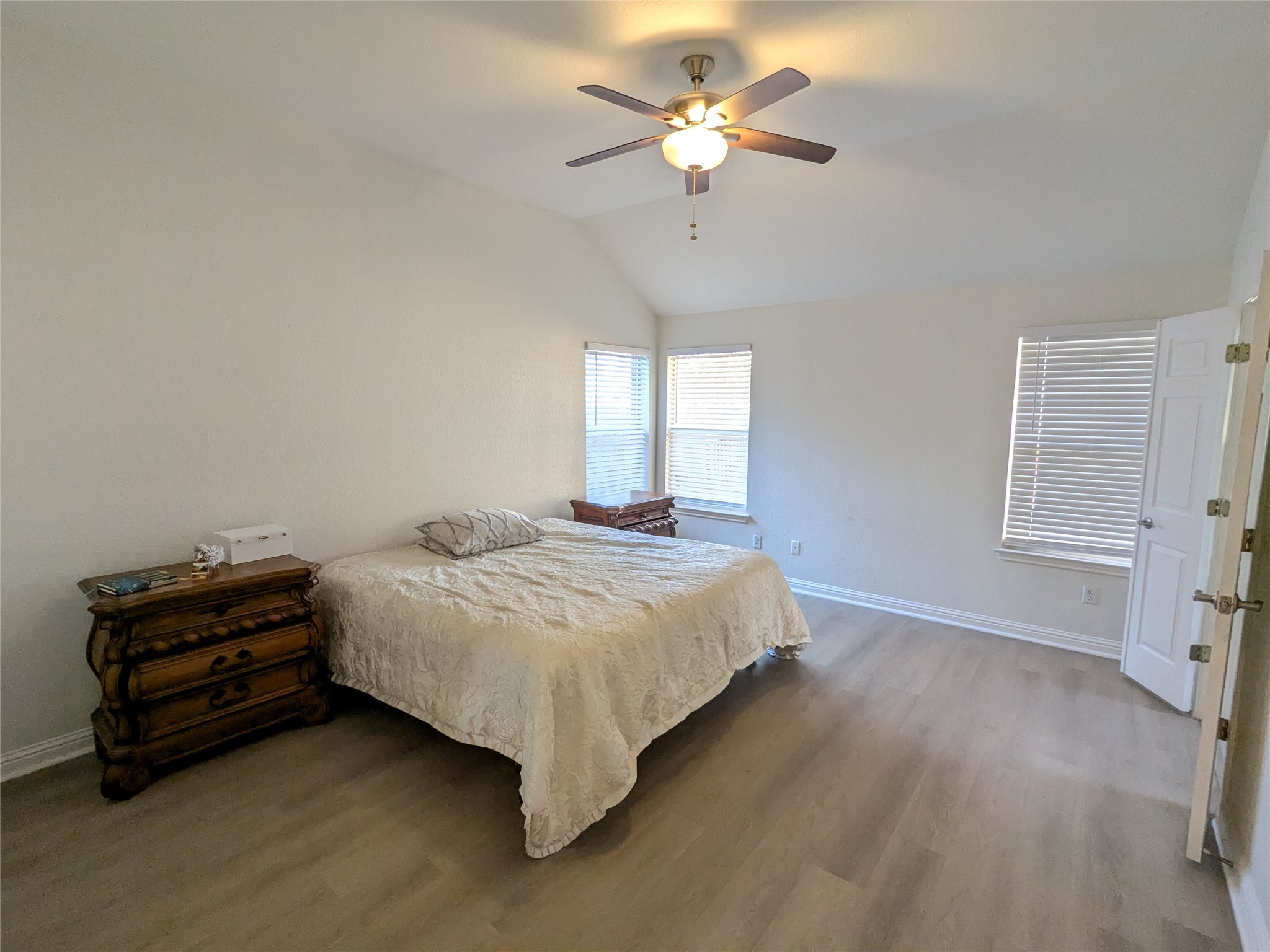 2008 Petrified Forest Drive Austin, TX 78747 - Photo 11 of 20 a bedroom with a bed chandelier and a window