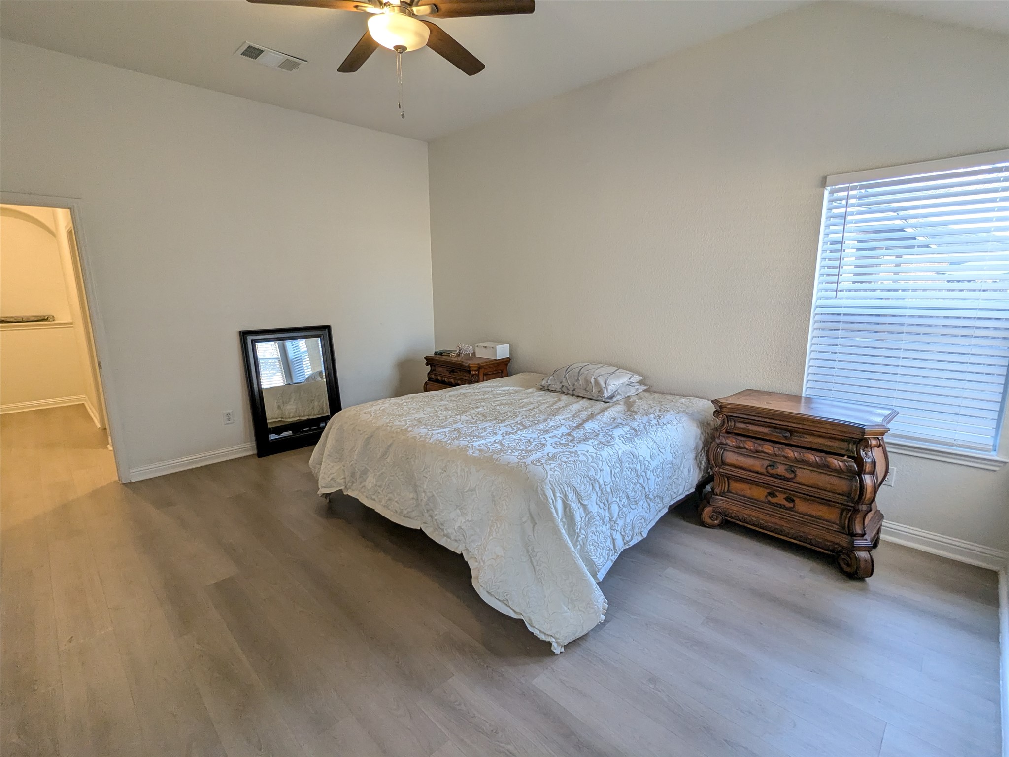 2008 Petrified Forest Drive Austin, TX 78747 - Photo 12 of 20 a bedroom with a bed and a chandelier