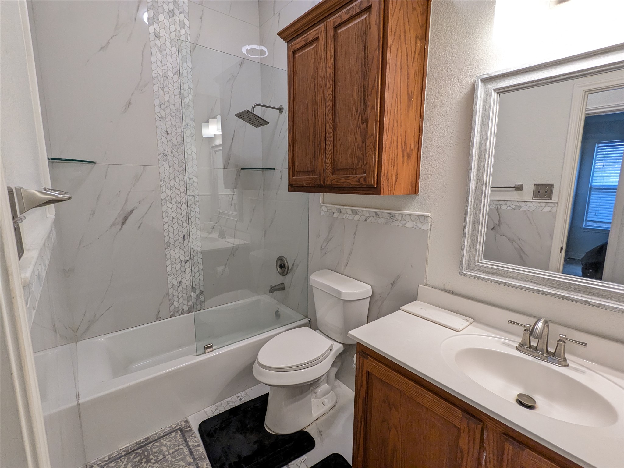 2008 Petrified Forest Drive Austin, TX 78747 - Photo 17 of 20 a bathroom with a sink toilet and shower