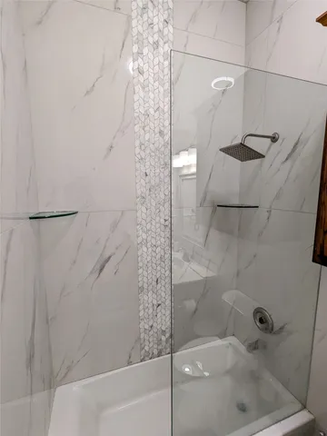 a bedroom with a bed and cabinets