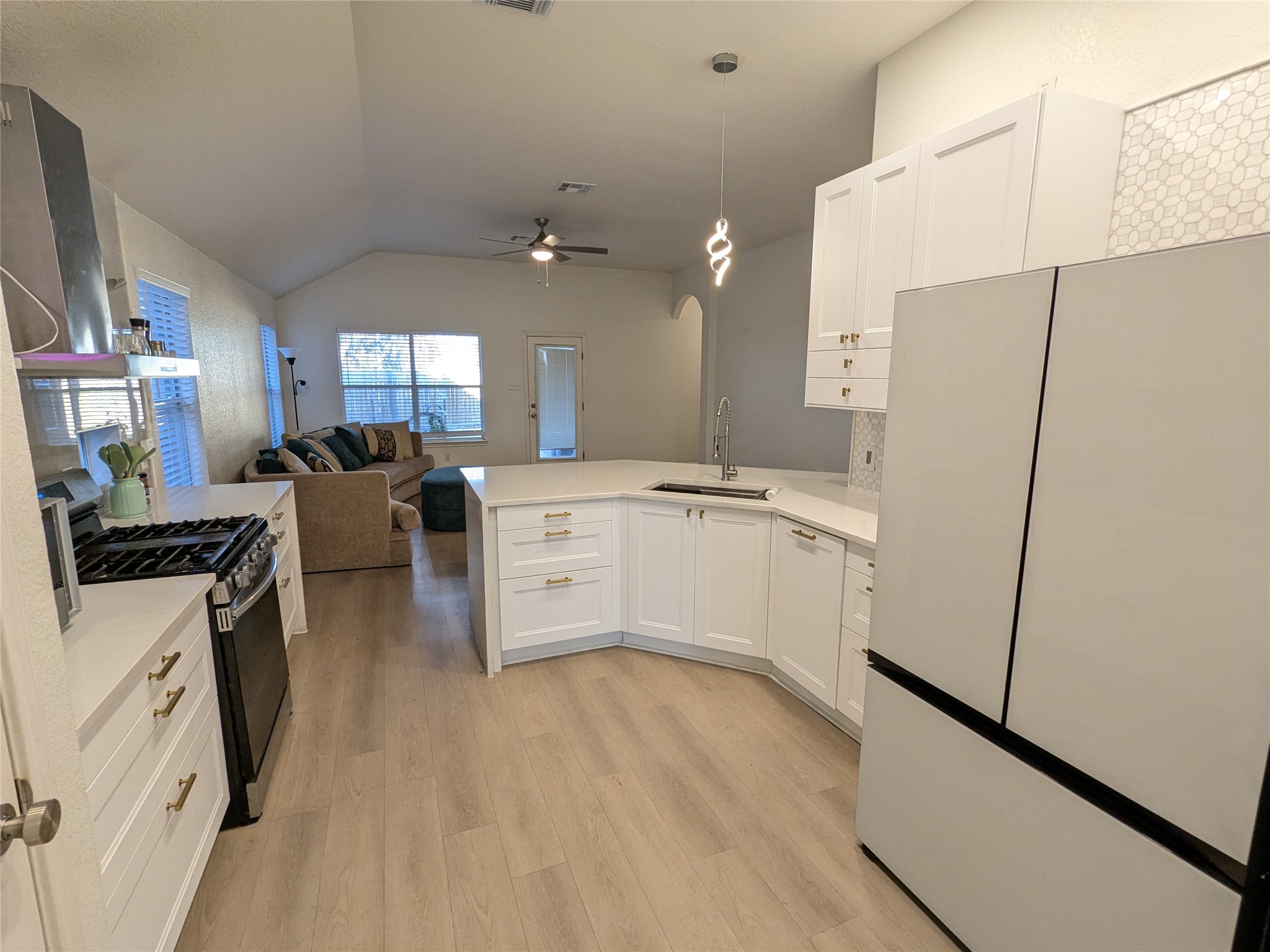 2008 Petrified Forest Drive Austin, TX 78747 - Photo 6 of 20 a kitchen with stainless steel appliances a refrigerator sink and white cabinets