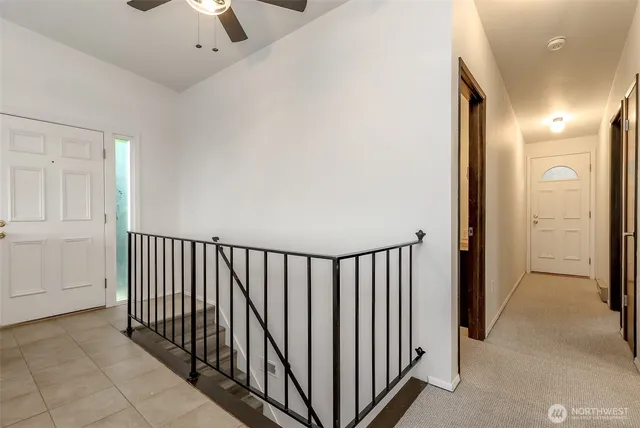 a view of a hallway with entryway door