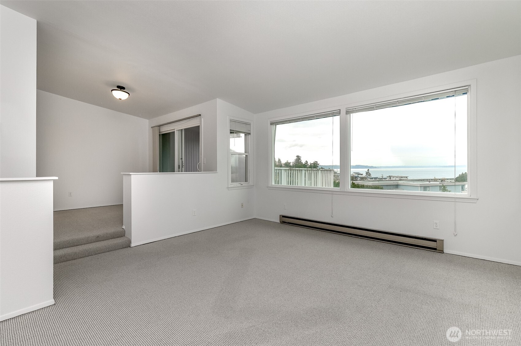 842 South 227th Place, Unit A Des Moines, WA 98198 - Photo 13 of 39 a view of an empty room with a window