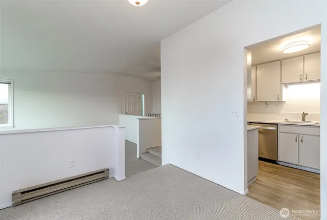 a view of a kitchen with a sink cabinets and a window