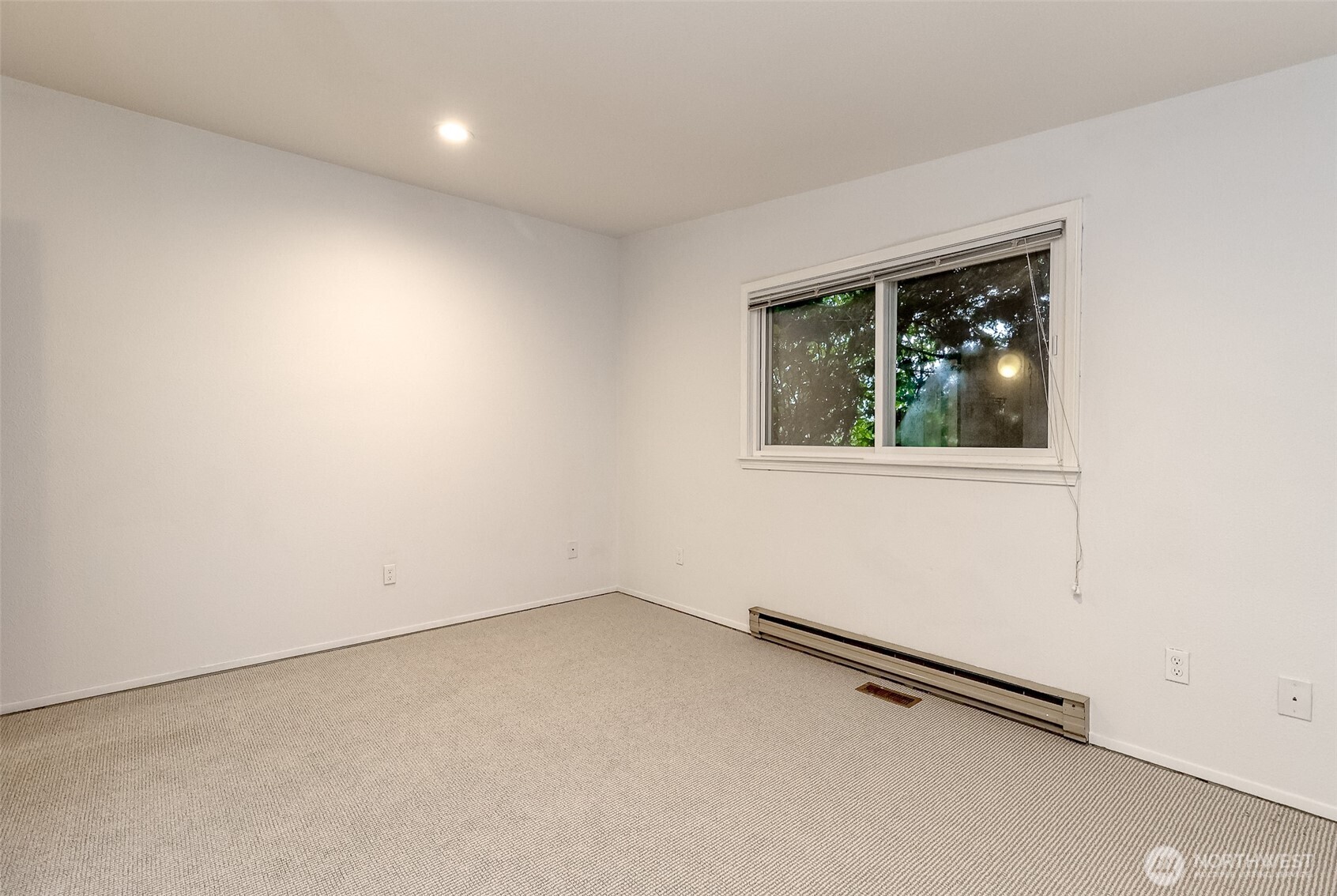 842 South 227th Place, Unit A Des Moines, WA 98198 - Photo 23 of 39 an empty room with a window