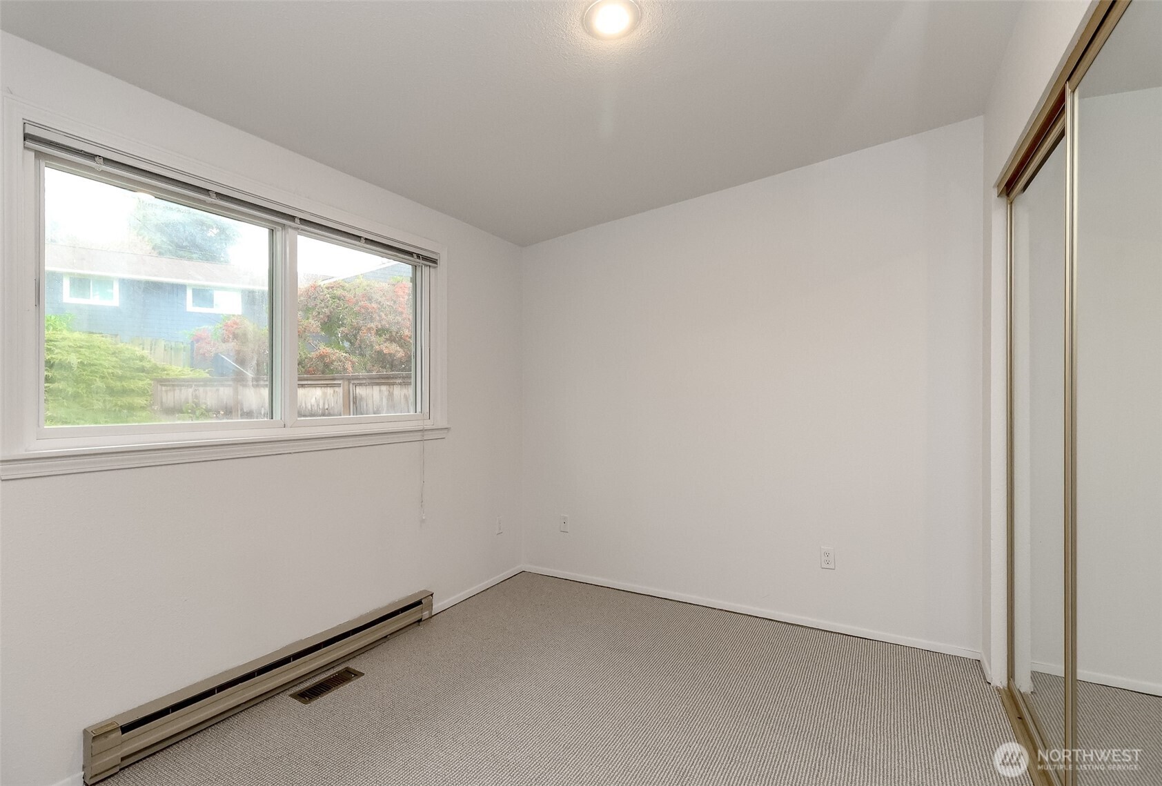 842 South 227th Place, Unit A Des Moines, WA 98198 - Photo 24 of 39 an empty room with a window