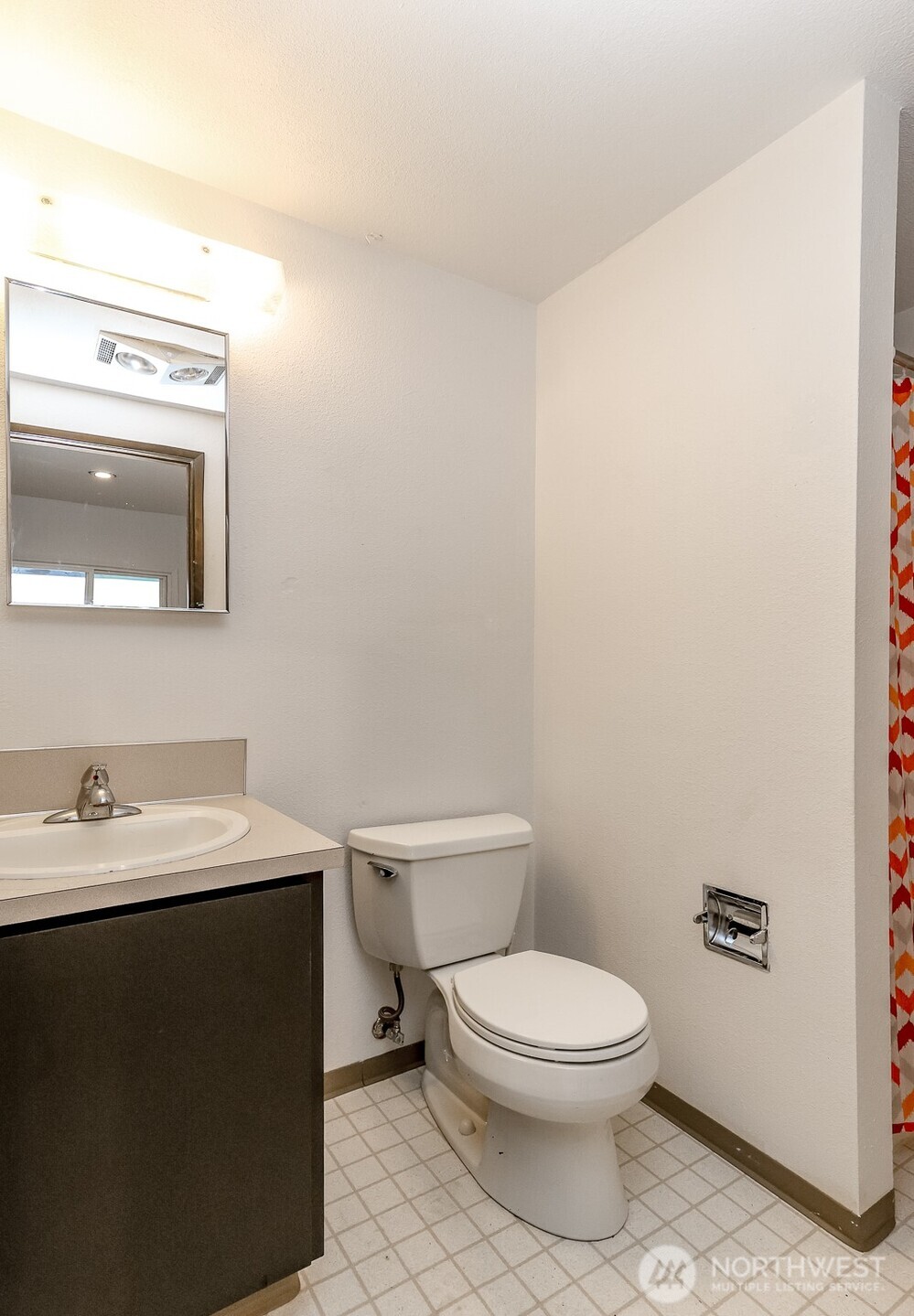 842 South 227th Place, Unit A Des Moines, WA 98198 - Photo 31 of 39 a white toilet sitting next to a bathroom sink