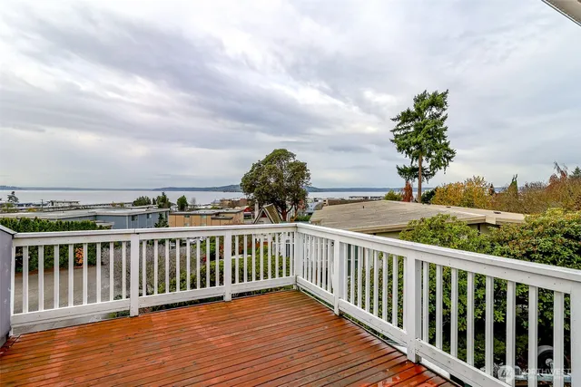 a view of a balcony with wooden floor