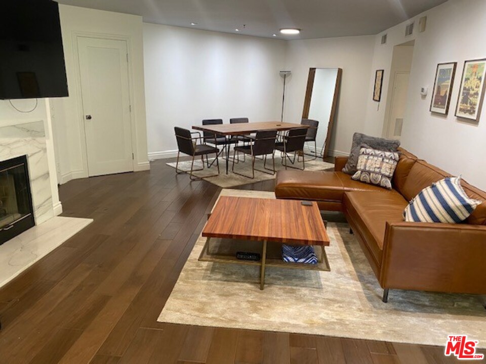 5805 Oak Bend Lane, Unit 210 Oak Park, CA 91377 - Photo 1 of 20 a living room with furniture and a fireplace