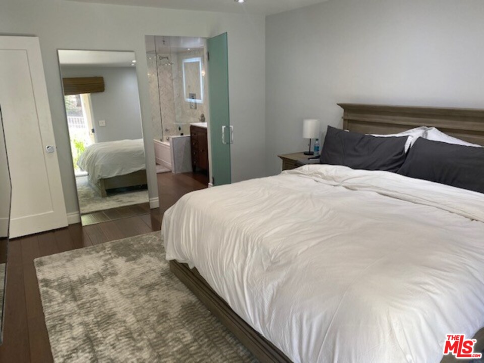 5805 Oak Bend Lane, Unit 210 Oak Park, CA 91377 - Photo 12 of 20 a bedroom with a bed and a couch