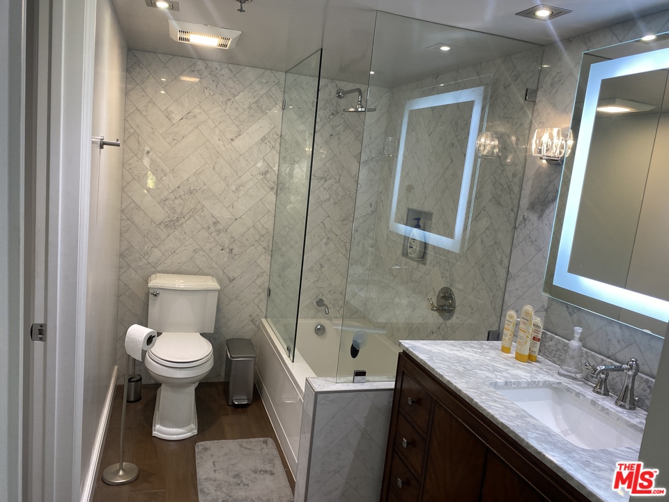 5805 Oak Bend Lane, Unit 210 Oak Park, CA 91377 - Photo 15 of 20 a bathroom with a sink toilet and shower