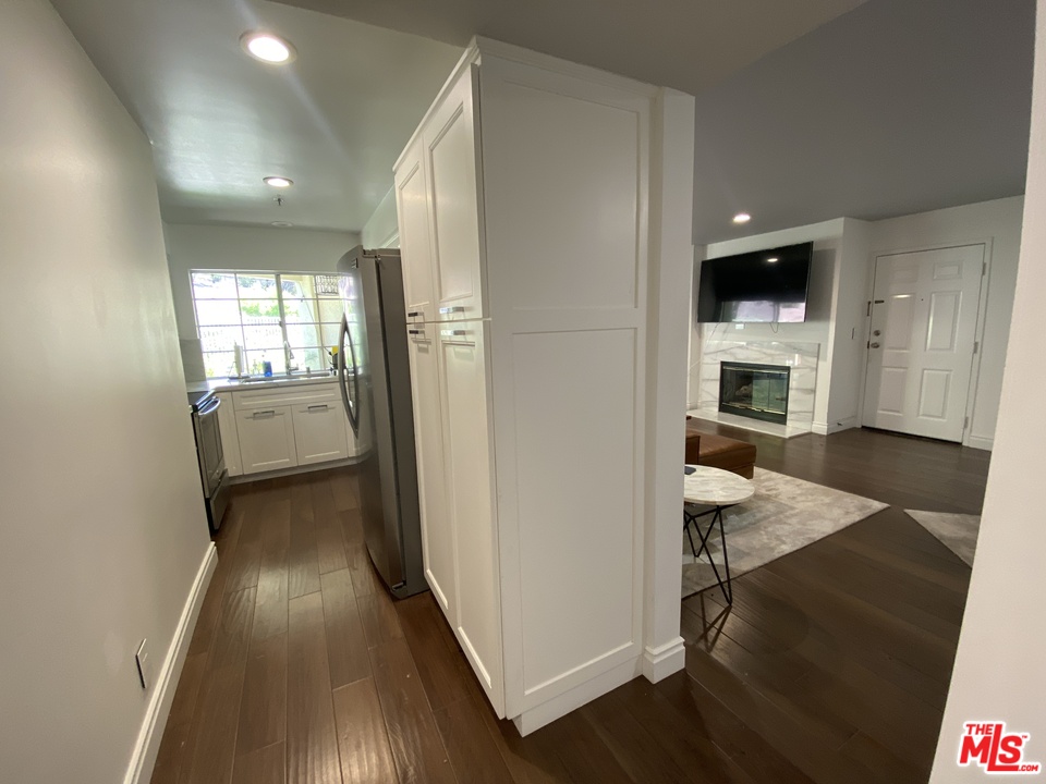 5805 Oak Bend Lane, Unit 210 Oak Park, CA 91377 - Photo 17 of 20 a view of a livingroom with furniture and a fireplace
