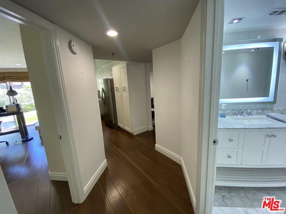 5805 Oak Bend Lane, Unit 210 Oak Park, CA 91377 - Photo 18 of 20 a bathroom with a sink and a mirror