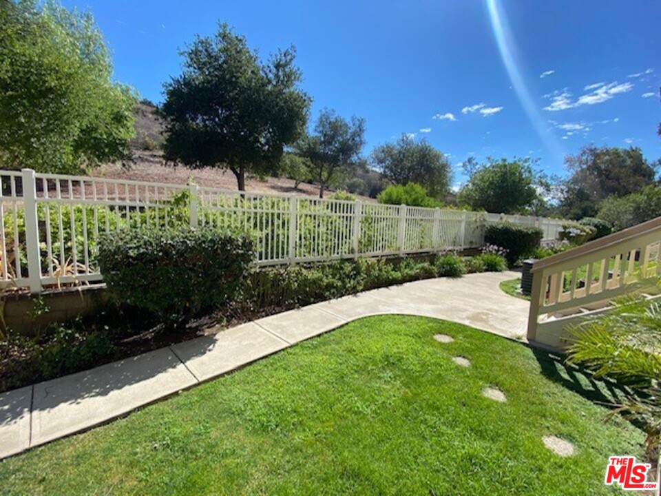 5805 Oak Bend Lane, Unit 210 Oak Park, CA 91377 - Photo 19 of 20 a view of a backyard