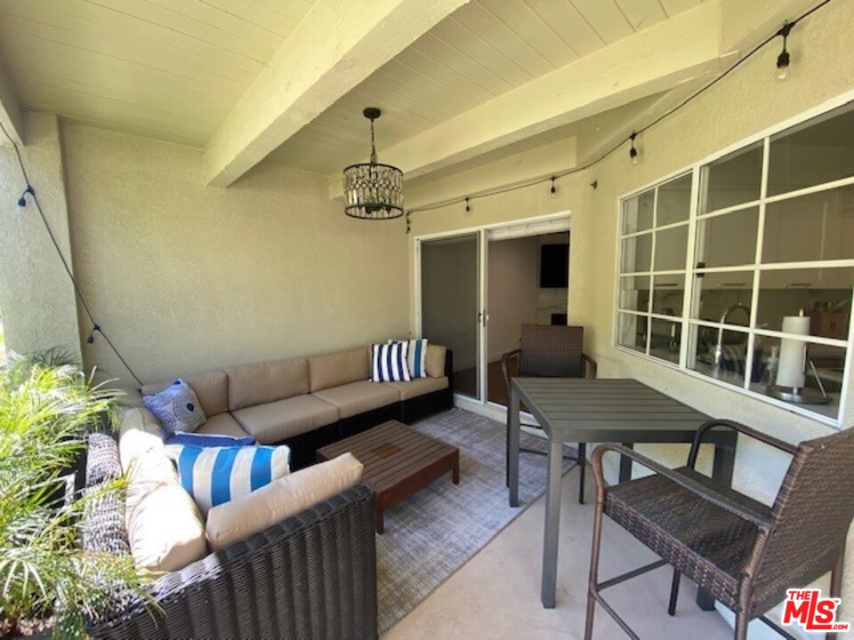 5805 Oak Bend Lane, Unit 210 Oak Park, CA 91377 - Photo 6 of 20 a outdoor living space with furniture