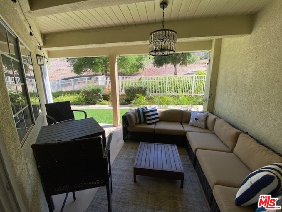5805 Oak Bend Lane, Unit 210 Oak Park, CA 91377 - Photo 7 of 20 a living room with furniture and a window