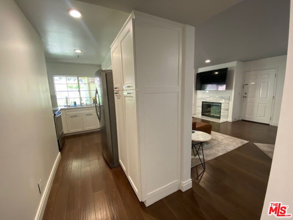 5805 Oak Bend Lane, Unit 210 Oak Park, CA 91377 - Photo 8 of 20 a view of a livingroom with furniture and a fireplace