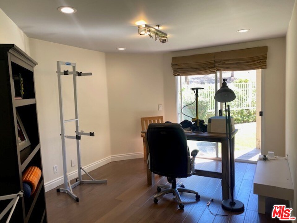 5805 Oak Bend Lane, Unit 210 Oak Park, CA 91377 - Photo 10 of 20 a view of a room with gym equipment