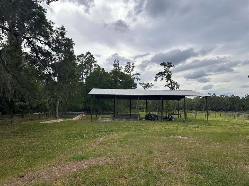 6800 Northeast 175th Street Road Citra, FL 32113 - Photo 27 of 27 a view of outdoor space with deck and trampoline