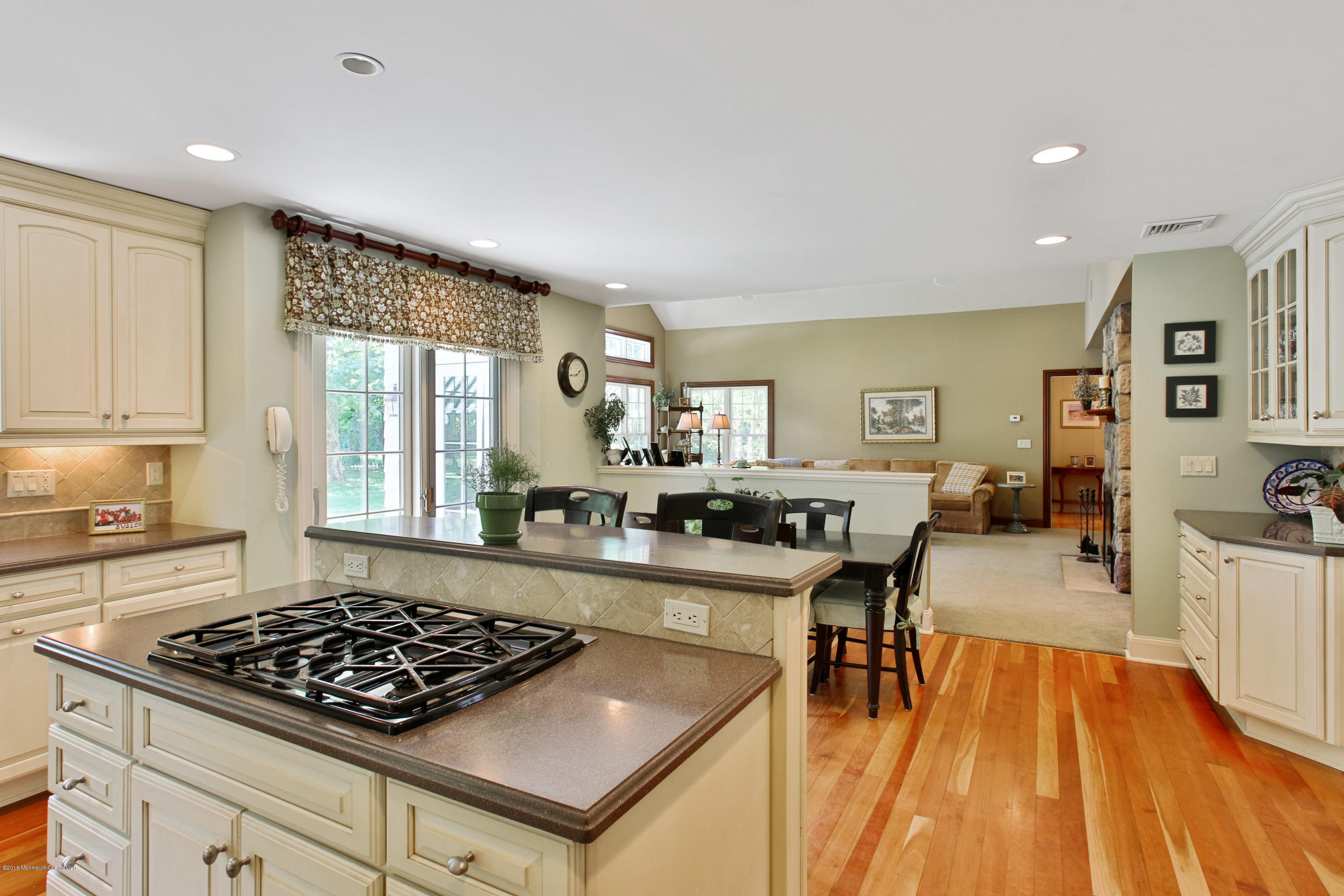 7 Partridge Way Colts Neck, NJ 07722 - Photo 13 of 50 a kitchen with stainless steel appliances granite countertop a stove top oven a sink dishwasher and cabinets with wooden floor