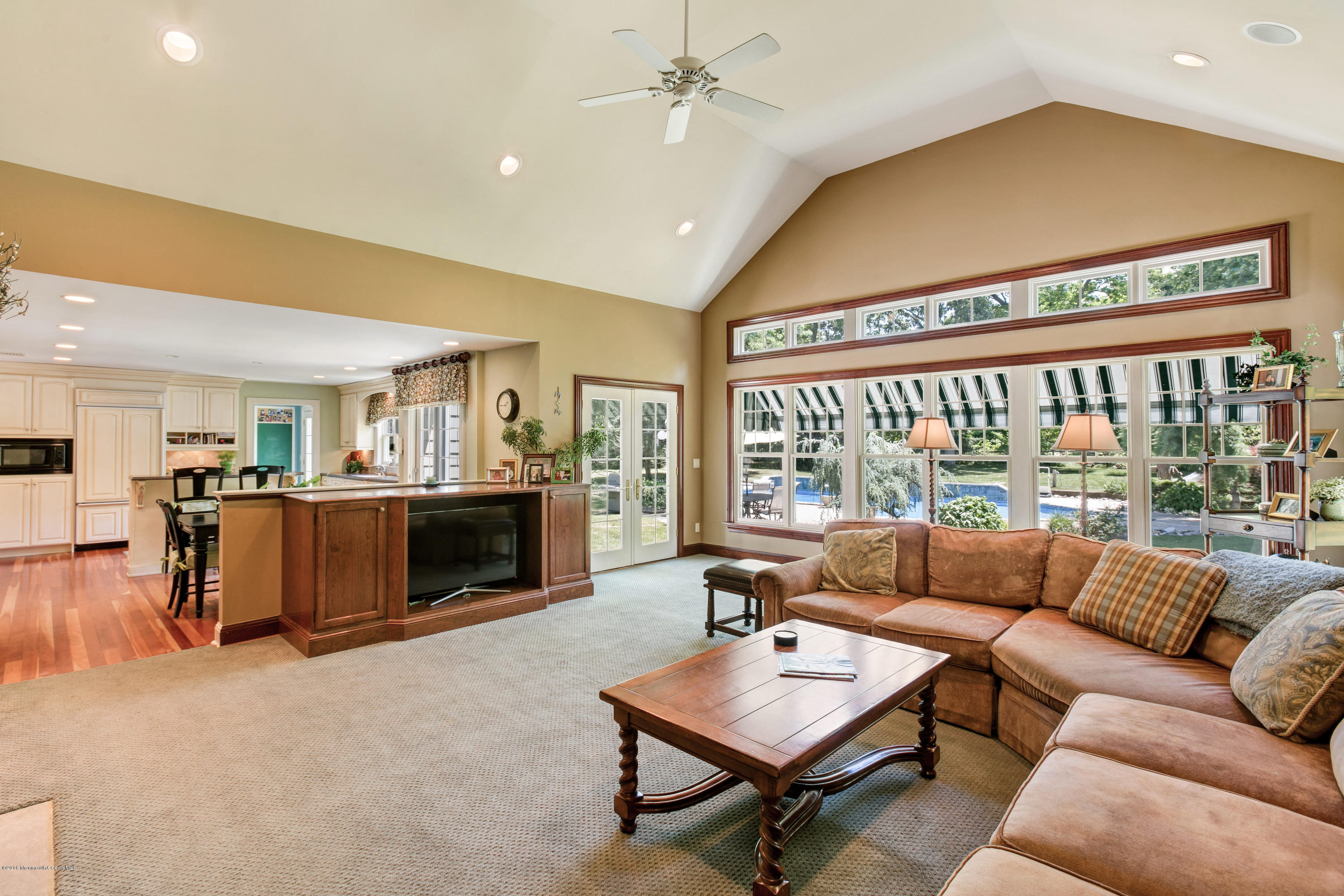 7 Partridge Way Colts Neck, NJ 07722 - Photo 21 of 50 a living room with furniture a fireplace and a large window