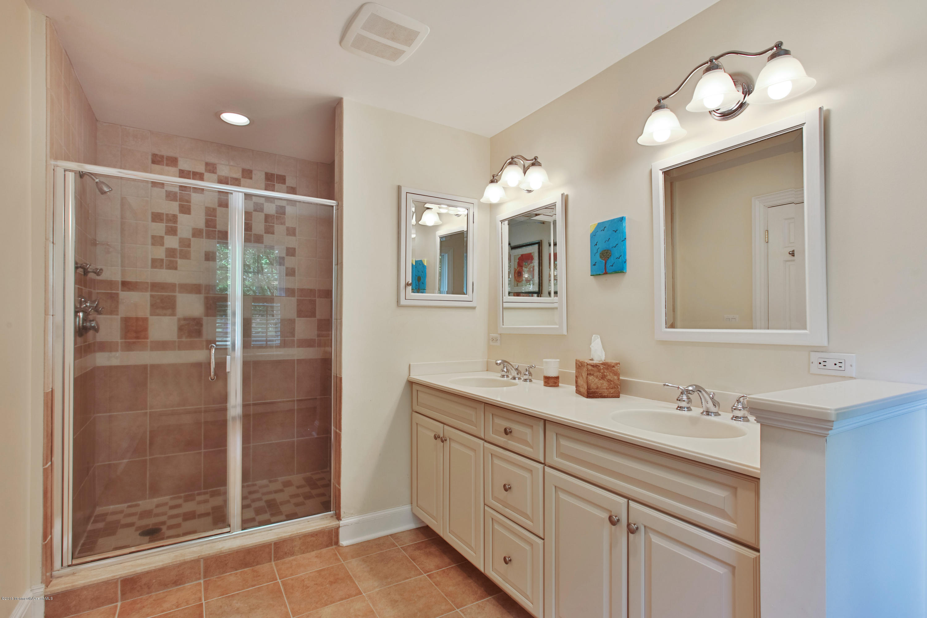 7 Partridge Way Colts Neck, NJ 07722 - Photo 28 of 50 a bathroom with a shower sink and mirror