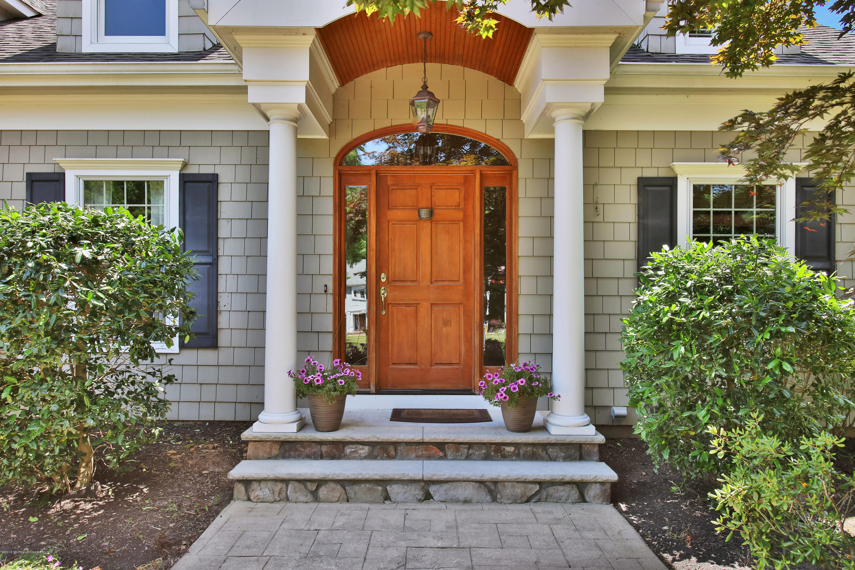 7 Partridge Way Colts Neck, NJ 07722 - Photo 5 of 50 a front view of a house with a garden