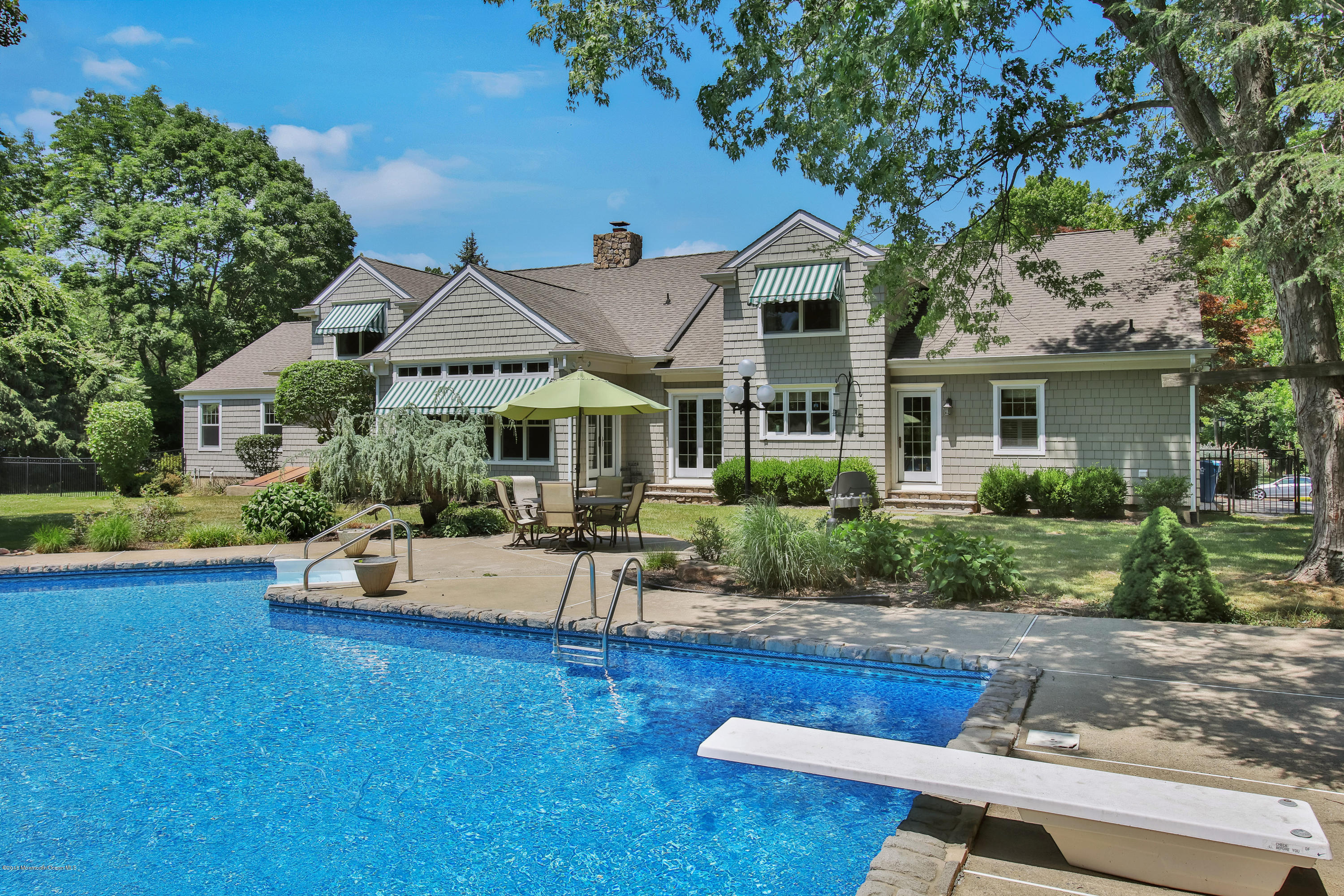 7 Partridge Way Colts Neck, NJ 07722 - Photo 41 of 50 a front view of house with yard and outdoor seating