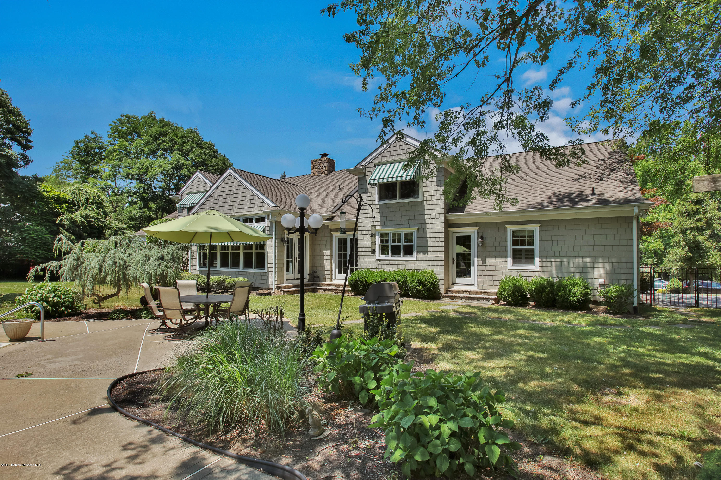 7 Partridge Way Colts Neck, NJ 07722 - Photo 48 of 50 a view of a house with backyard sitting area and garden