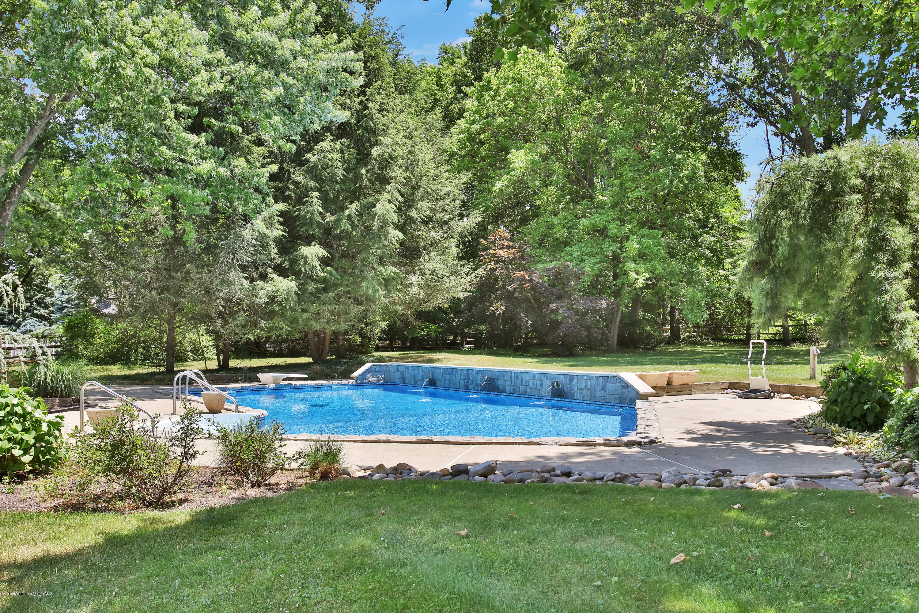 7 Partridge Way Colts Neck, NJ 07722 - Photo 49 of 50 a view of backyard with lawn chairs and trees