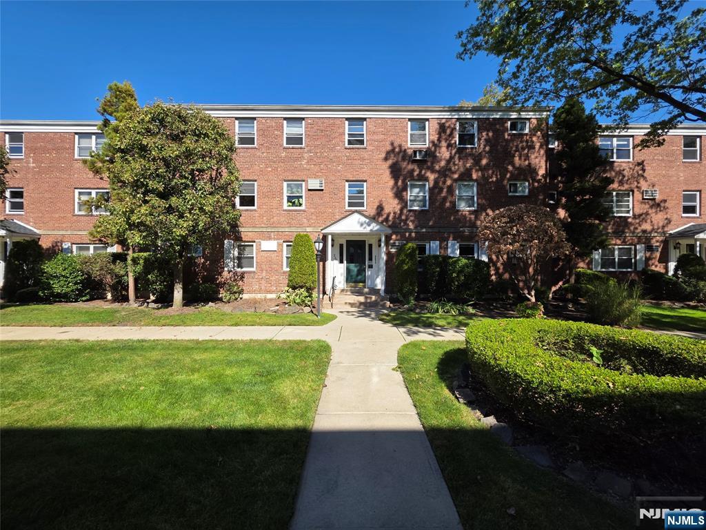245 Johnson Avenue, Unit K1 Hackensack, NJ 07601 - Photo 14 of 15 a front view of a house with a yard
