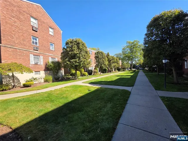 a view of a building with a yard