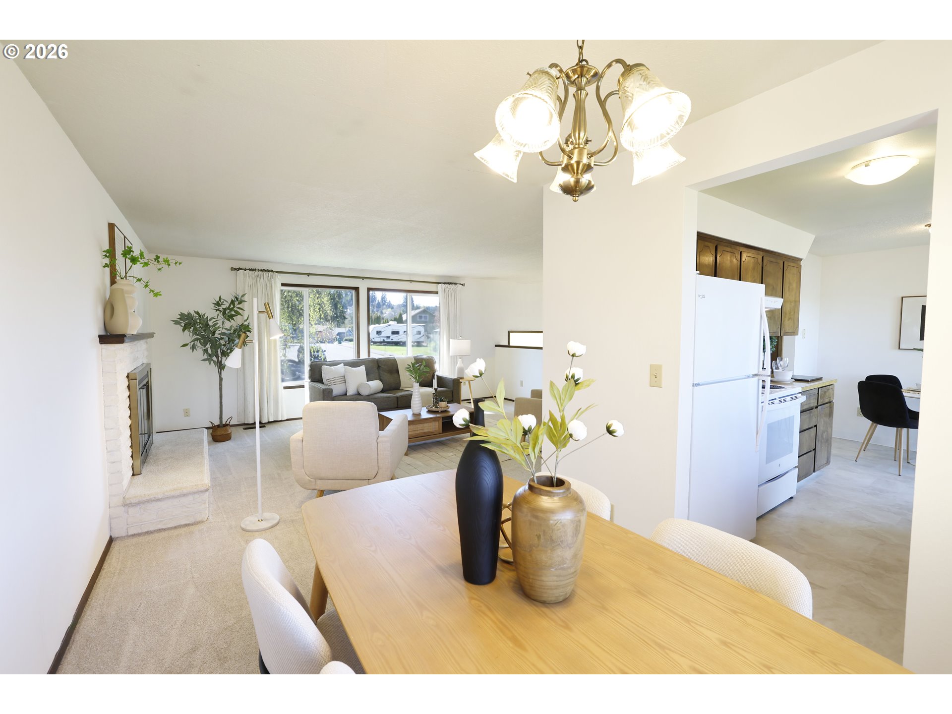 16285 Southwest Rosa Road Beaverton, OR 97007 - Photo 5 of 20 a dining room with furniture and a chandelier