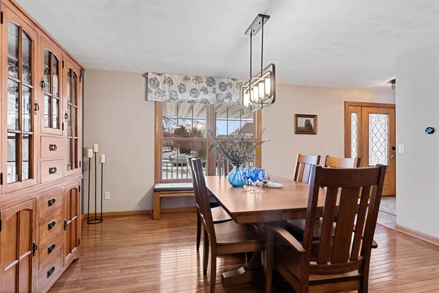 a bedroom with a bed and a ceiling fan