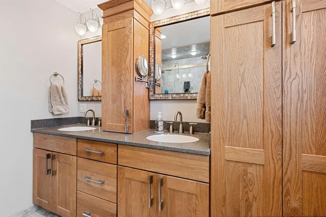 a white toilet sitting next to a bathroom sink