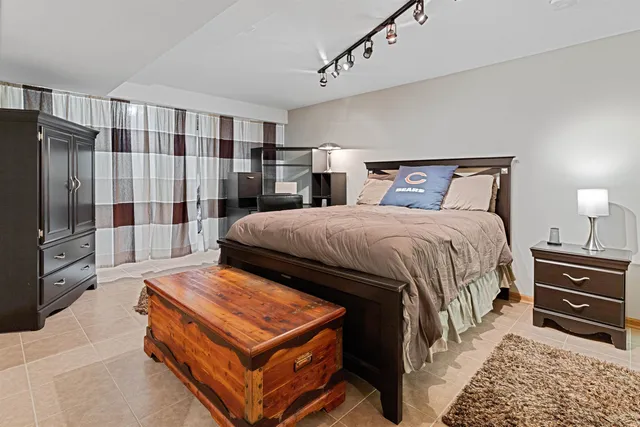 a view of a wooden floor and a bench in front of a house