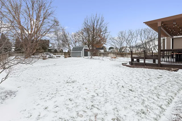 a backyard of a house with lots of green space and lake view