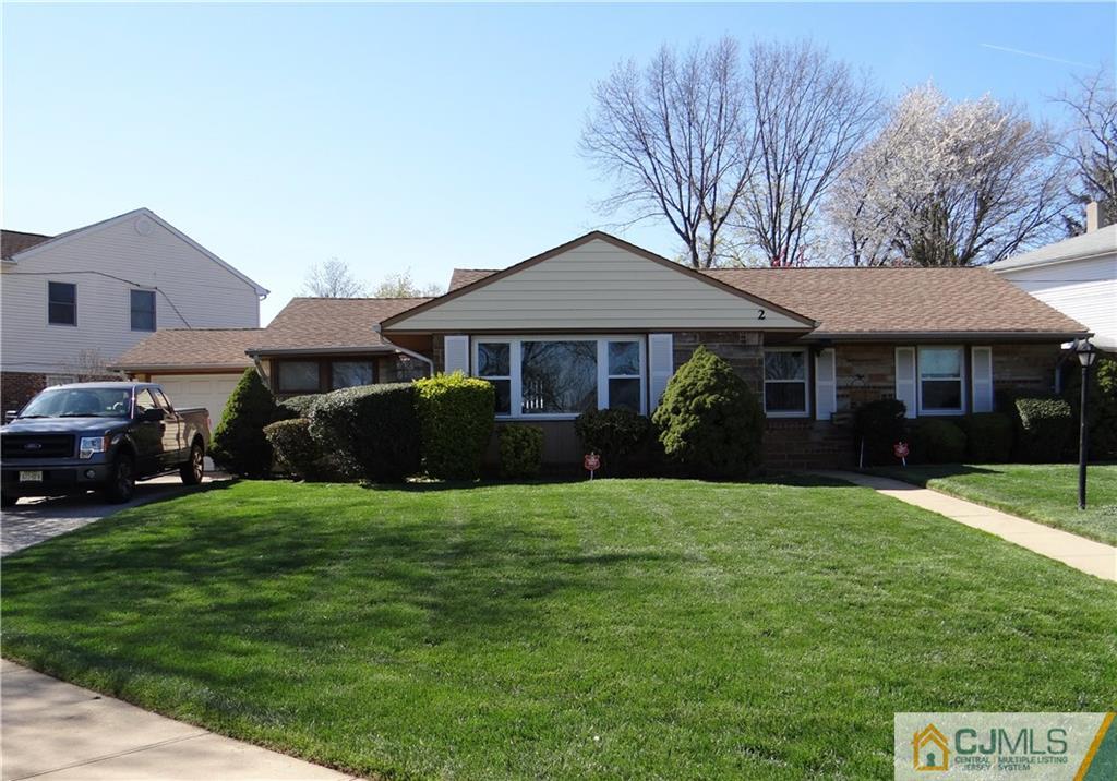 2 Roger Road Edison, NJ 08817 - Photo 1 of 16 a front view of a house with a garden