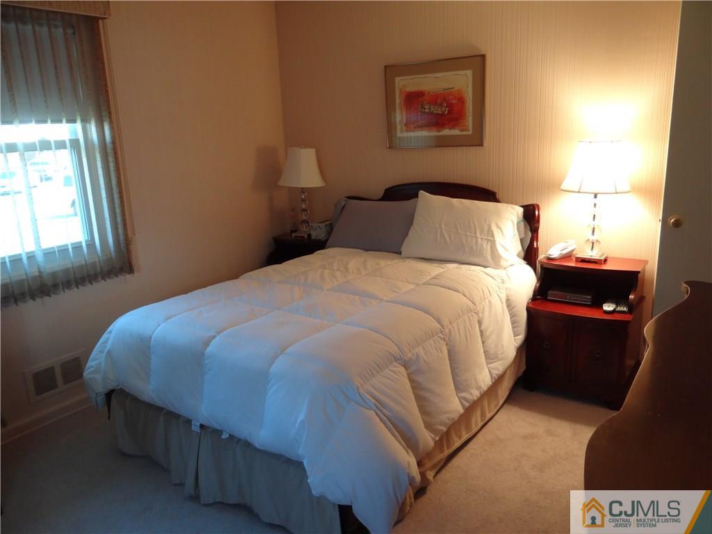 2 Roger Road Edison, NJ 08817 - Photo 13 of 16 a bedroom with bed and window