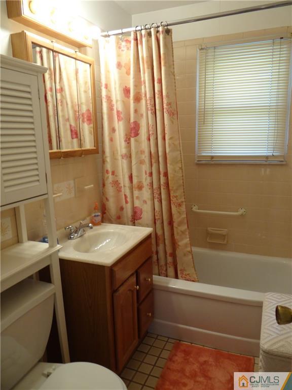 2 Roger Road Edison, NJ 08817 - Photo 14 of 16 a bathroom with a sink toilet and tub
