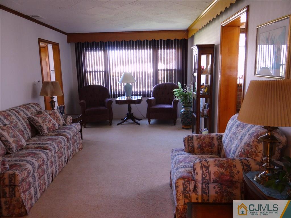 2 Roger Road Edison, NJ 08817 - Photo 8 of 16 a living room with furniture and a window