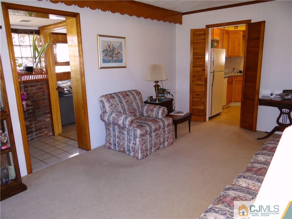 2 Roger Road Edison, NJ 08817 - Photo 9 of 16 a living room with furniture and a gate